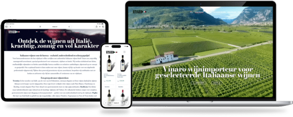 Responsive devices showing a wine brand website on laptop, tablet and phone over a vineyard background.